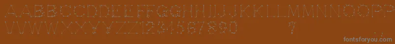 Шрифт Opointefait – серые шрифты на коричневом фоне