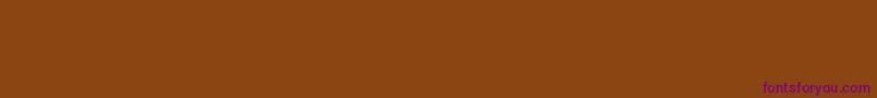 Czcionka PaintItGothRus – fioletowe czcionki na brązowym tle