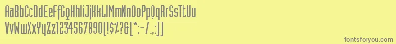 Czcionka IndustriaLtSolidA – szare czcionki na żółtym tle
