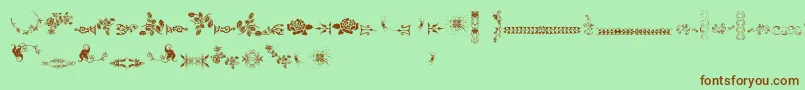Czcionka UnpublishedOrnamentsTwo – brązowe czcionki na zielonym tle