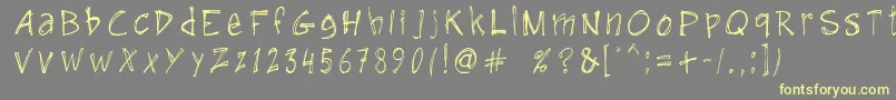 GuruHand12008-fontti – keltaiset fontit harmaalla taustalla
