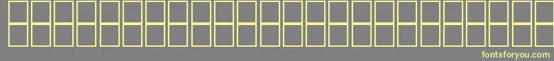 AlKharashi65 Font – Yellow Fonts on Gray Background