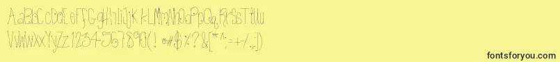 Htkissme Font – Black Fonts on Yellow Background