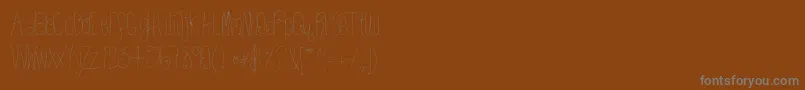 Htkissme Font – Gray Fonts on Brown Background