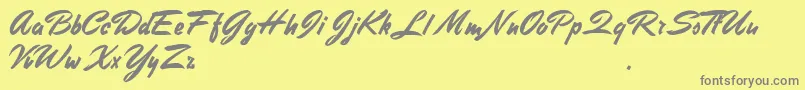 Fonte StephensHeavyWriting – fontes cinzas em um fundo amarelo