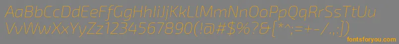 Шрифт Exo2.0Thinitalic – оранжевые шрифты на сером фоне