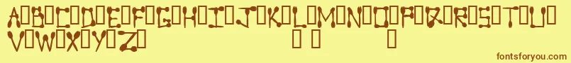 Sporktype Font – Brown Fonts on Yellow Background