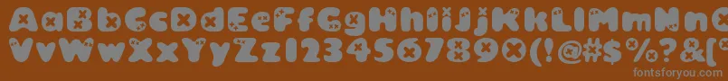 Bambino ffy-fontti – harmaat kirjasimet ruskealla taustalla