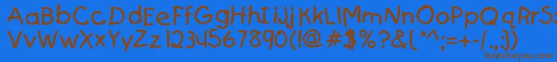 フォントKajakaRegular – 茶色の文字が青い背景にあります。