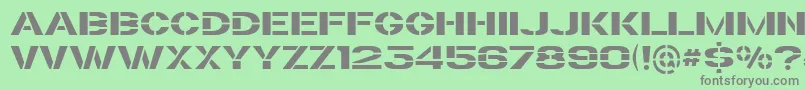 Czcionka TrafaretKit – szare czcionki na zielonym tle
