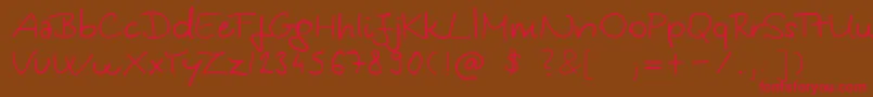 フォントKingaSHandwriting – 赤い文字が茶色の背景にあります。