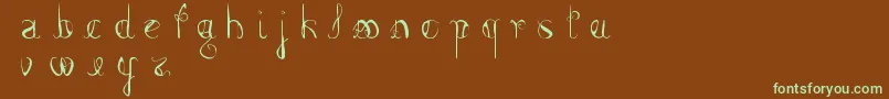 FemmeFatal-Schriftart – Grüne Schriften auf braunem Hintergrund