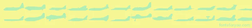 フォントPlaness – 黄色い背景に緑の文字