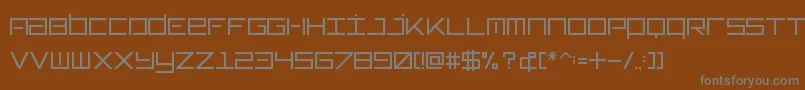 Typeone-fontti – harmaat kirjasimet ruskealla taustalla