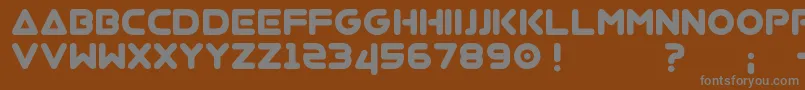 Virgo01-fontti – harmaat kirjasimet ruskealla taustalla