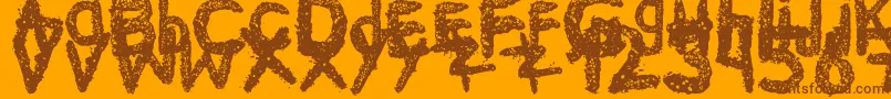 Ke$Hanimal2-fontti – ruskeat fontit oranssilla taustalla