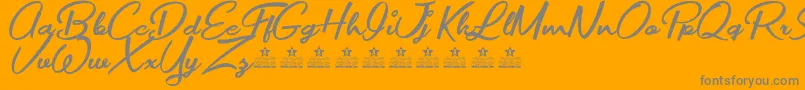 Fonte MovieMakersPersonalUse – fontes cinzas em um fundo laranja