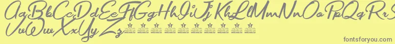 Шрифт MovieMakersPersonalUse – серые шрифты на жёлтом фоне