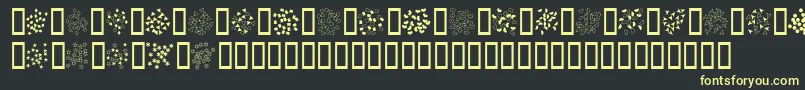 Confetti-Schriftart – Gelbe Schriften auf schwarzem Hintergrund