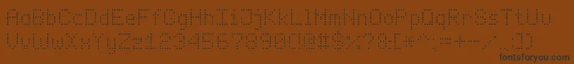 フォントEnhancedDotDigital7 – 黒い文字が茶色の背景にあります