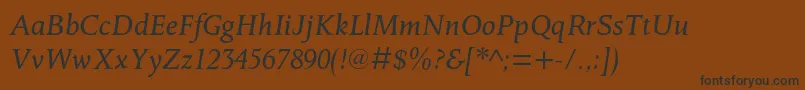 フォントOctavianmtstdItalic – 黒い文字が茶色の背景にあります
