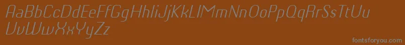 ChiqReducedLightitalic-Schriftart – Graue Schriften auf braunem Hintergrund
