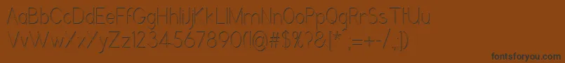 GrutchgroteskshadedCondensedlight Font – Black Fonts on Brown Background