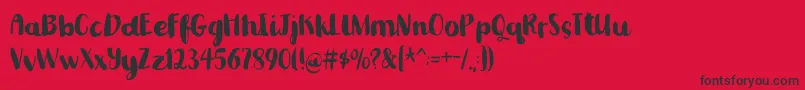 Romkugledemo-fontti – mustat fontit punaisella taustalla