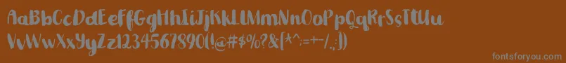 Шрифт Romkugledemo – серые шрифты на коричневом фоне