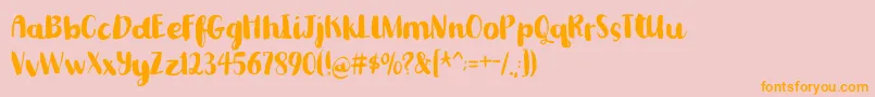 フォントRomkugledemo – オレンジの文字がピンクの背景にあります。