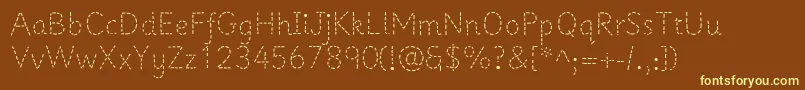 Prima1-fontti – keltaiset fontit ruskealla taustalla