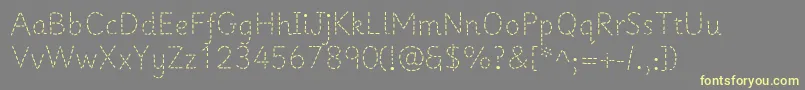Prima1-Schriftart – Gelbe Schriften auf grauem Hintergrund