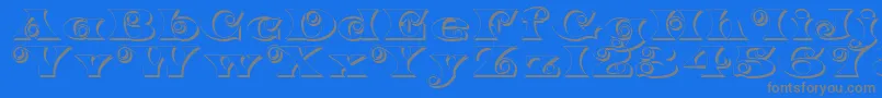 K22SpiralSwashShadow-fontti – harmaat kirjasimet sinisellä taustalla
