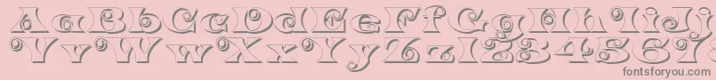K22SpiralSwashShadow-fontti – harmaat kirjasimet vaaleanpunaisella taustalla