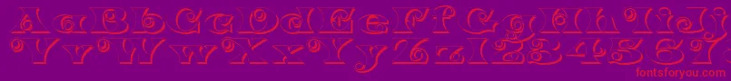 K22SpiralSwashShadow Font – Red Fonts on Purple Background