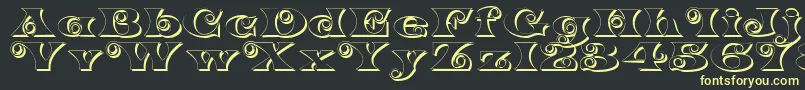 K22SpiralSwashShadow Font – Yellow Fonts on Black Background