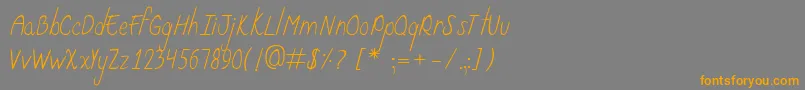 フォントCurzab – オレンジの文字は灰色の背景にあります。