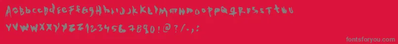 フォントTheEvilCop – 赤い背景に灰色の文字