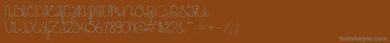 SweetNovember Font – Gray Fonts on Brown Background