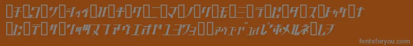 フォントGolgothaObliqueJ. – 茶色の背景に灰色の文字