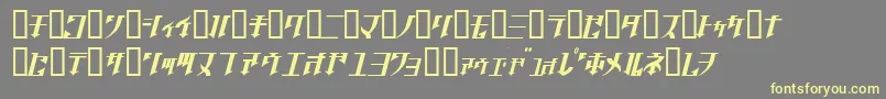 フォントGolgothaObliqueJ. – 黄色のフォント、灰色の背景