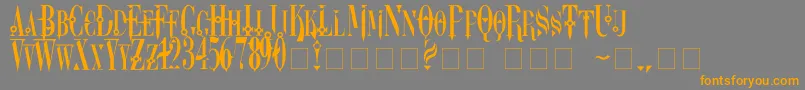 フォントDreamscarc – オレンジの文字は灰色の背景にあります。