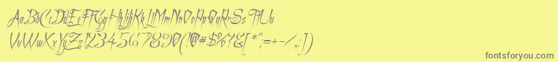 フォントACharmingFontItalic – 黄色の背景に灰色の文字