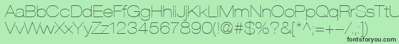 HelveticaLt23UltraLightExtended-Schriftart – Schwarze Schriften auf grünem Hintergrund