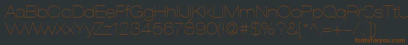 HelveticaLt23UltraLightExtended-Schriftart – Braune Schriften auf schwarzem Hintergrund