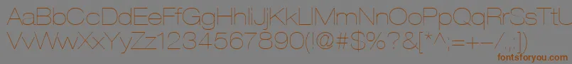 HelveticaLt23UltraLightExtended-Schriftart – Braune Schriften auf grauem Hintergrund