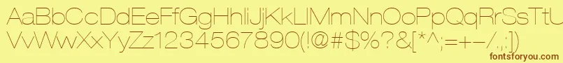 フォントHelveticaLt23UltraLightExtended – 茶色の文字が黄色の背景にあります。