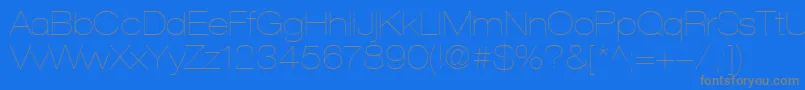 HelveticaLt23UltraLightExtended-fontti – harmaat kirjasimet sinisellä taustalla