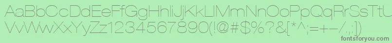 フォントHelveticaLt23UltraLightExtended – 緑の背景に灰色の文字