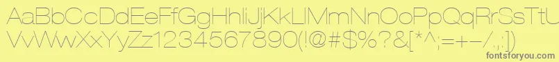 HelveticaLt23UltraLightExtended-Schriftart – Graue Schriften auf gelbem Hintergrund